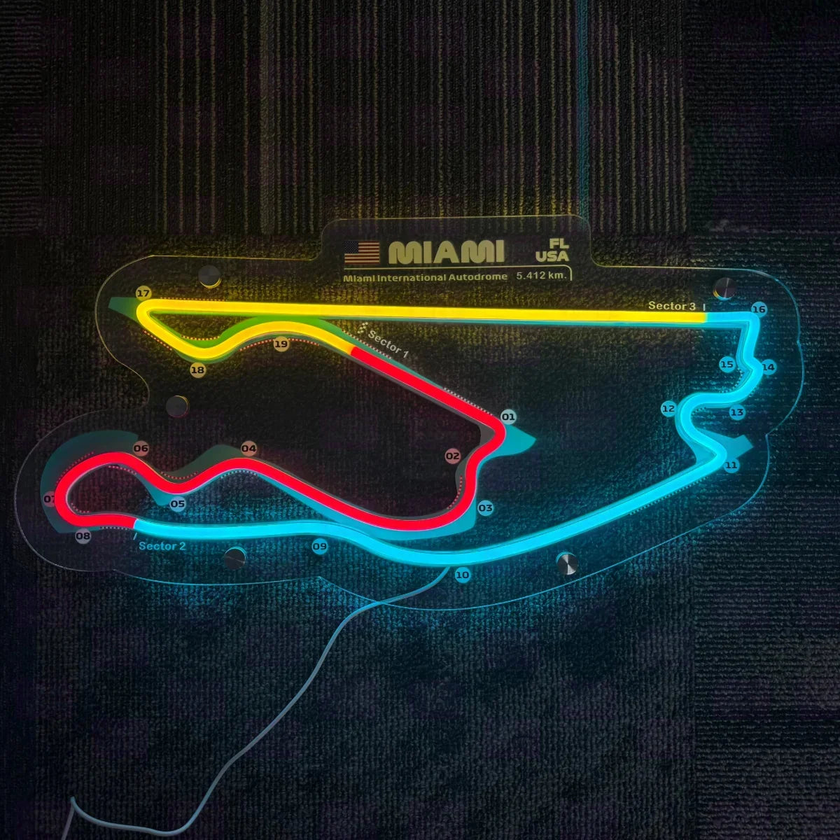 Miami Autodrome race circuit LED neon sign glowing in yellow, pink and blue