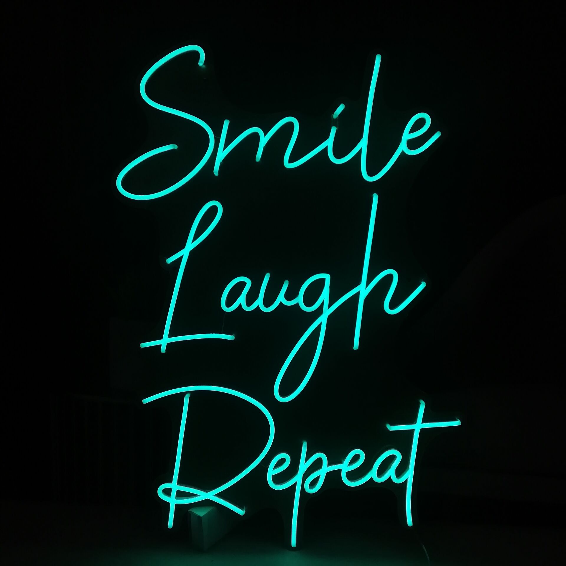 Smile Laugh Repeat LED Neon Sign in Hot Pink