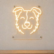 MEON NEON-watermarked concept mockup of a Warm White Border Collie head LED neon sign with a blank acrylic area for a UV-printed breed caption or dog name.