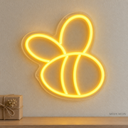 Watermarked concept mockup of the Mini Bee LED Neon Sign in Yellow on a clear acrylic backboard.