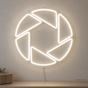 Watermarked concept mockup of the Mini Camera Aperture LED Neon Sign in White on a clear acrylic backboard.