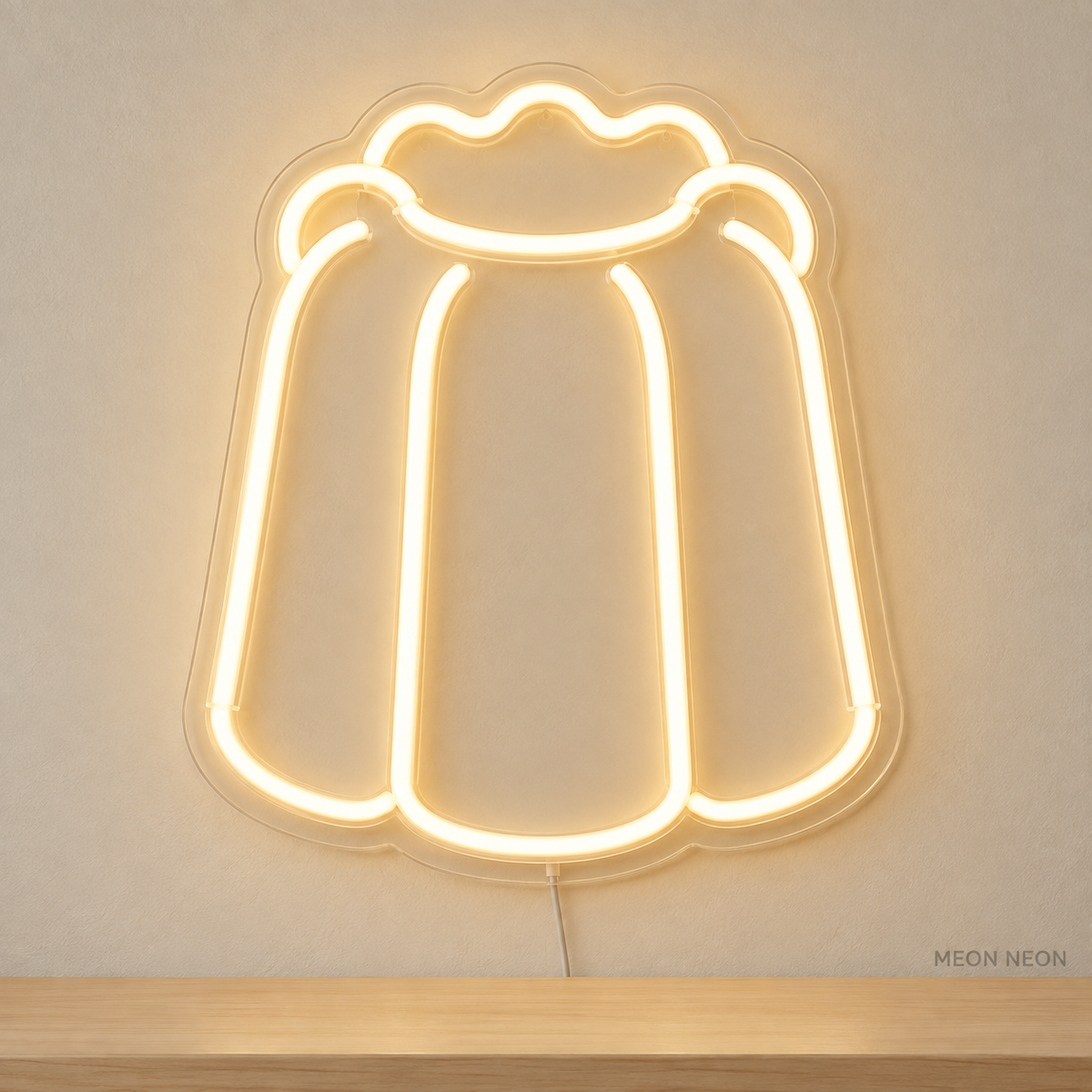 Watermarked concept mockup of Mini Canele LED Neon Sign in Warm White on a clear acrylic backboard.