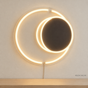 Watermarked concept mockup of Mini Eclipse Halo LED Neon Sign in Warm White on a clear acrylic backboard.