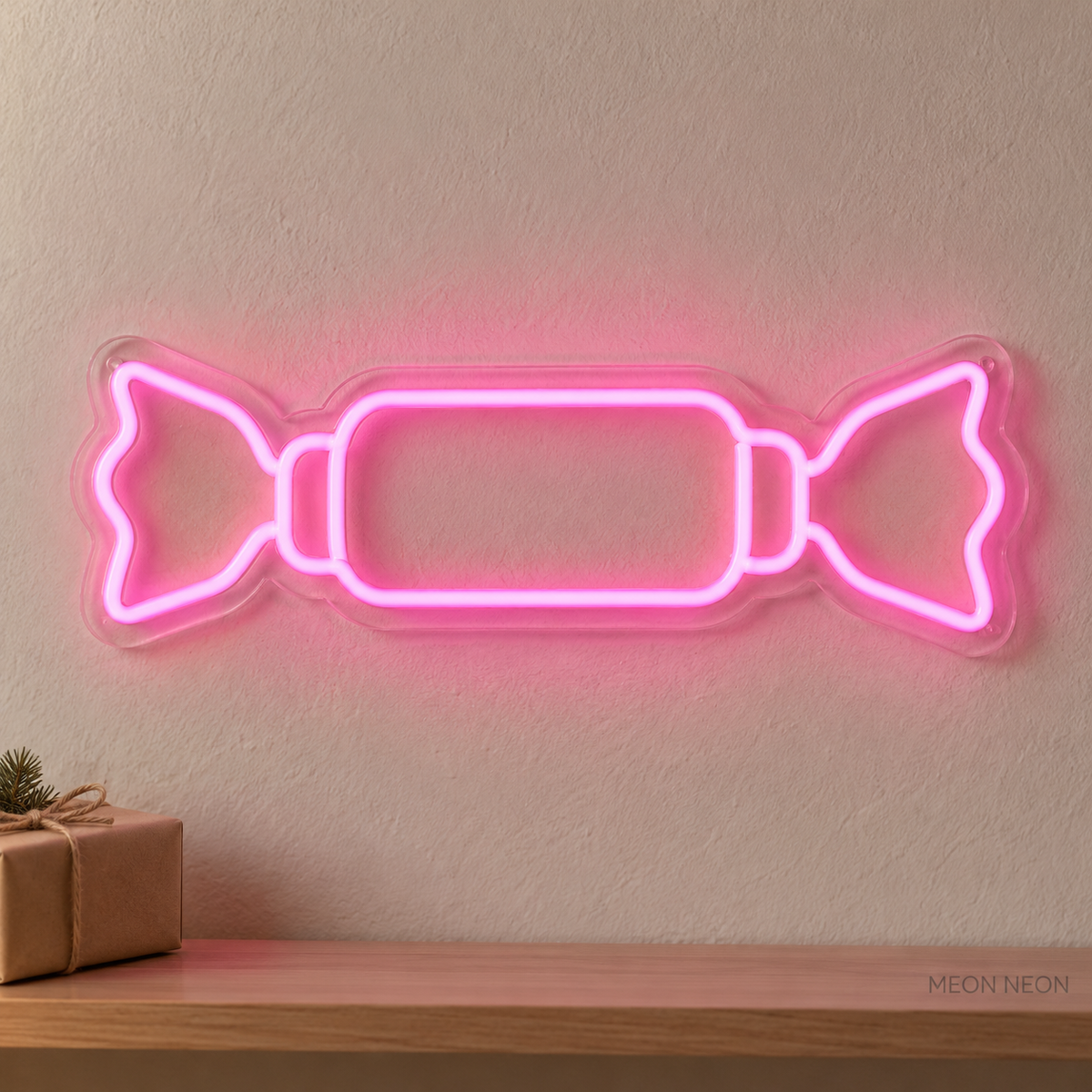 Watermarked concept mockup of the Mini Holiday Cracker LED Neon Sign in Pink on a clear acrylic backboard.