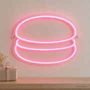 Watermarked concept mockup of the Mini Macaron LED Neon Sign in Pink on a clear acrylic backboard.
