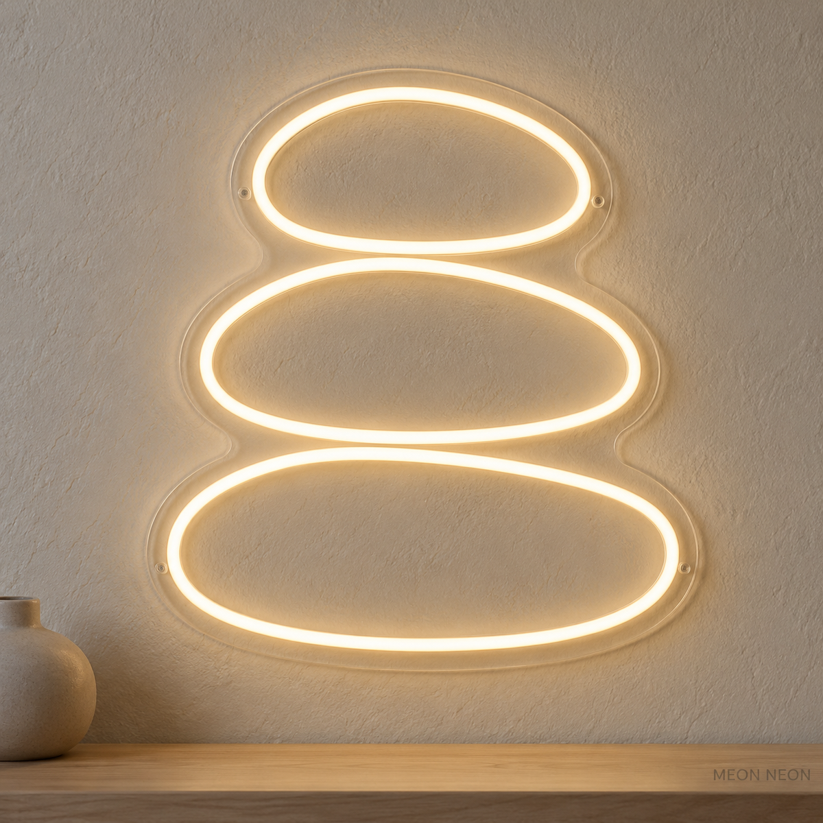 Watermarked concept mockup of Mini Massage Stones LED Neon Sign in Warm White on a clear acrylic backboard.