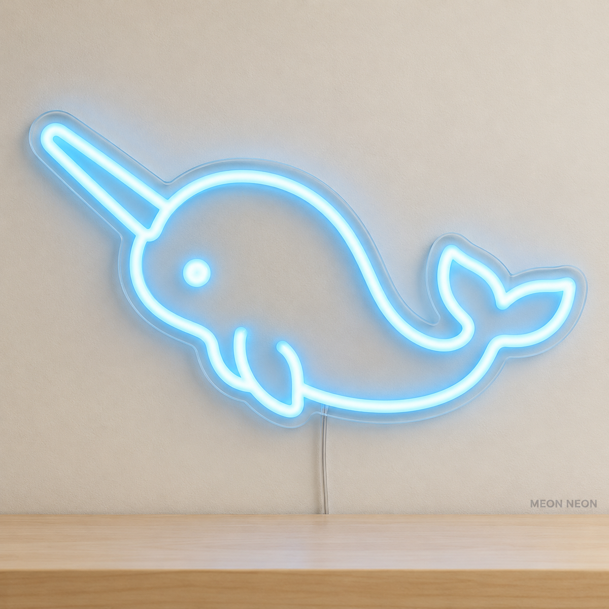 Watermarked concept mockup of Mini Narwhal LED Neon Sign in Ice Blue on a clear acrylic backboard.