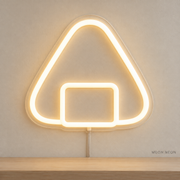 Watermarked concept mockup of Mini Onigiri LED Neon Sign in Warm White on a clear acrylic backboard.