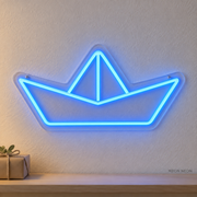 Watermarked concept mockup of the Mini Origami Boat LED Neon Sign in Blue on a clear acrylic backboard.