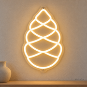 Watermarked concept mockup of Mini Pinecone LED Neon Sign in Warm White on a clear acrylic backboard.