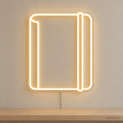 Watermarked concept mockup of Mini Pocket Journal LED Neon Sign in Warm White on a clear acrylic backboard.