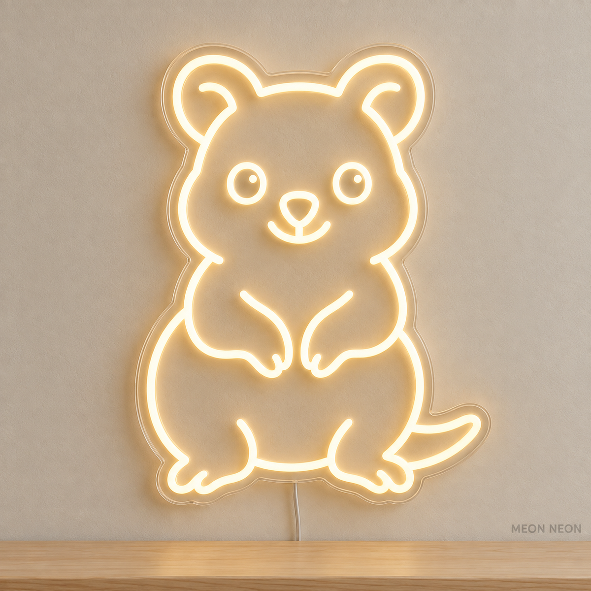 Watermarked concept mockup of Mini Quokka LED Neon Sign in Warm White on a clear acrylic backboard.