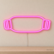 Watermarked concept mockup of Mini Resistance Band LED Neon Sign in Pink on a clear acrylic backboard.