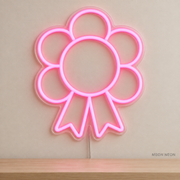 Watermarked concept mockup of Mini Riding Rosette LED Neon Sign in Pink on a clear acrylic backboard.