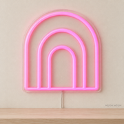 Watermarked concept mockup of Mini Ripple Arch LED Neon Sign in Pink on a clear acrylic backboard.