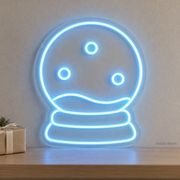 Watermarked concept mockup of the Mini Snow Globe LED Neon Sign in Ice Blue on a clear acrylic backboard.