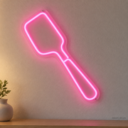Watermarked concept mockup of Mini Spatula LED Neon Sign in Pink on a clear acrylic backboard.
