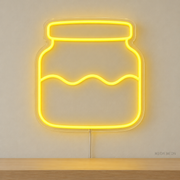 Watermarked concept mockup of Mini Starter Jar LED Neon Sign in Yellow on a clear acrylic backboard.
