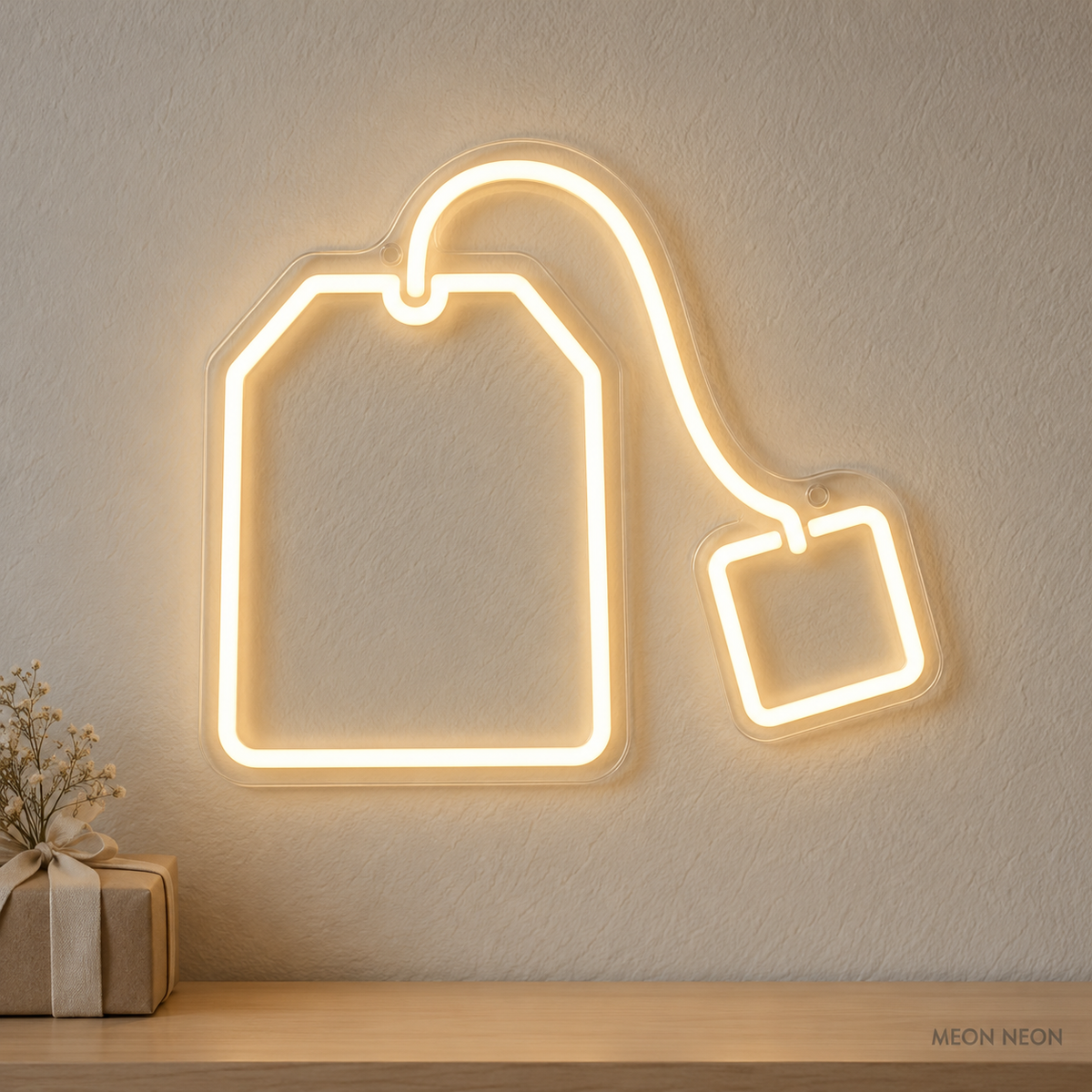 Watermarked concept mockup of the Mini Tea Bag LED Neon Sign in Warm White on a clear acrylic backboard.