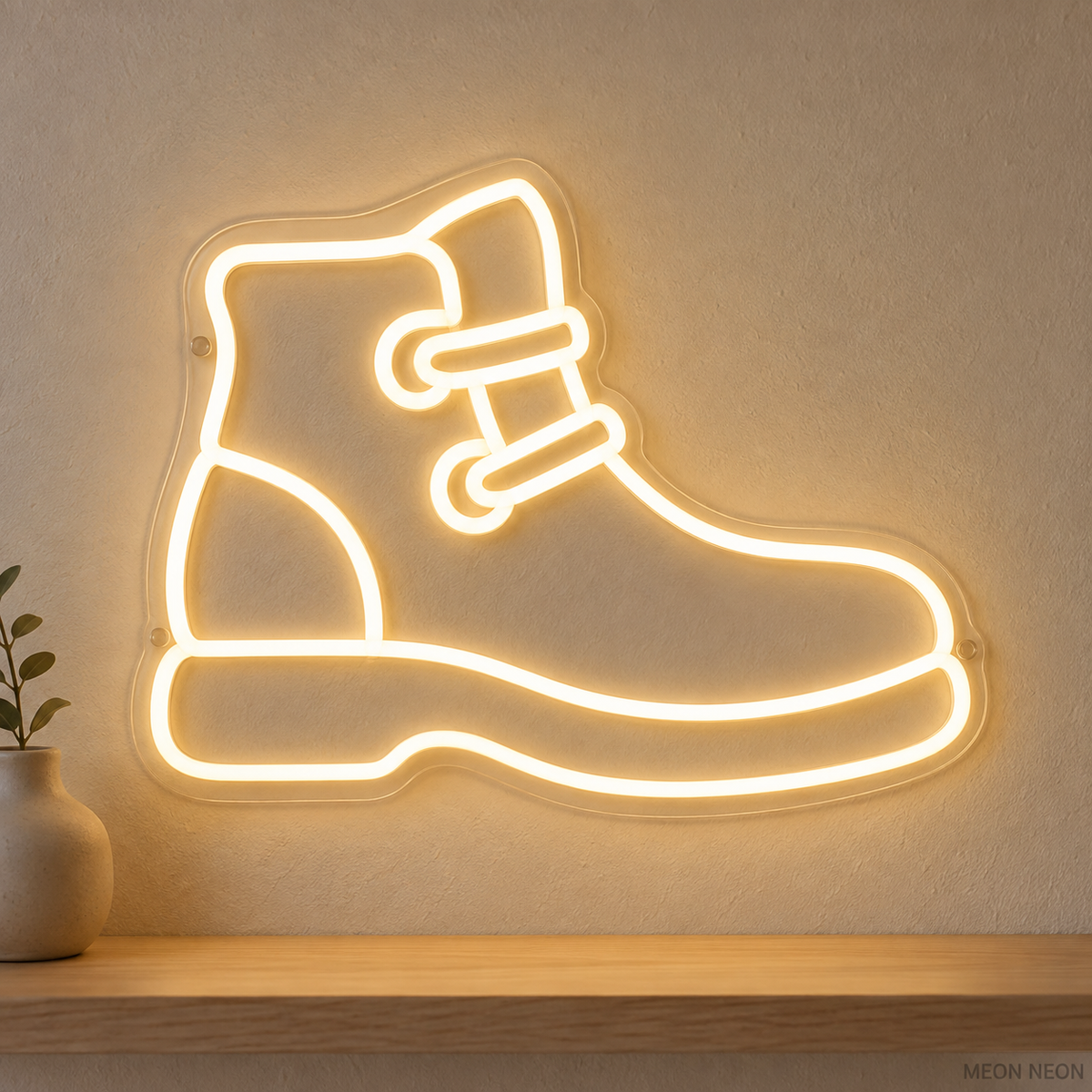 Watermarked concept mockup of Mini Trail Boot LED Neon Sign in Warm White on a clear acrylic backboard.