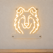 MEON NEON-watermarked concept mockup of a Warm White Shetland Sheepdog head LED neon sign with a blank acrylic area for a UV-printed breed caption or dog name.